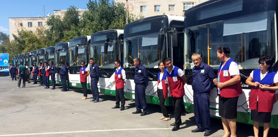 Drivers with the new fleet of green buses in Kazakhstan